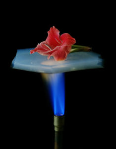 Aerogel suspended over a flame